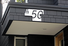 Irregularly-shaped metal plate reads #50